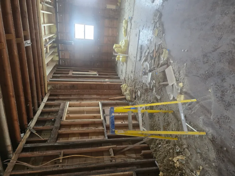 Construction debris removal — gutted room